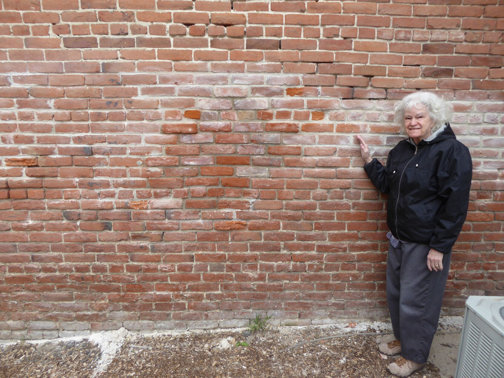 Cathy shows the repair.JPG